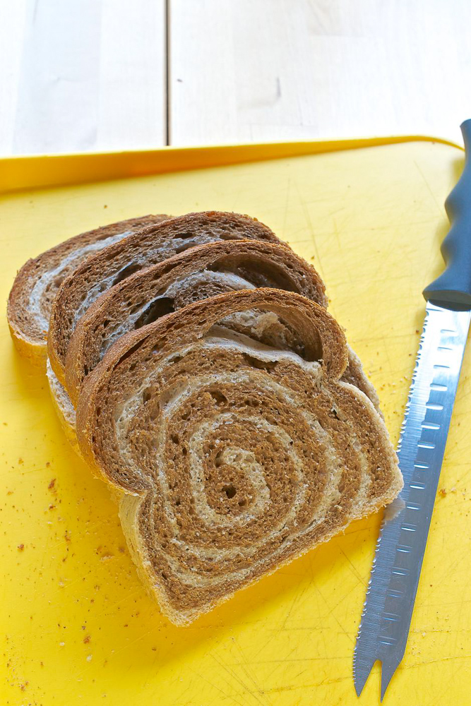 Dark and light rye rolled up to give a swirl inside this marbled rye loaf