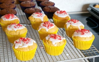 Vanilla muffins made with custard powder, filled with your favourite jam and drizzled with glacé icing