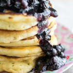 Thick puffy American style pancakes with maple blueberry syrup