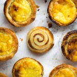 How to make pasteis de nata at home - Portuguese custard tarts made with vanilla creme pat in a cinnamon swirl puff pastry case