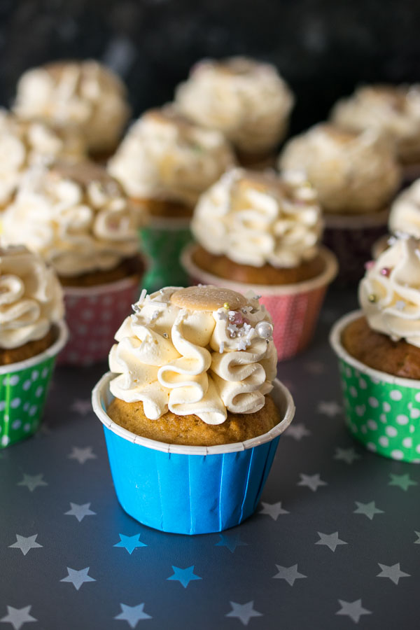Butterbeer cupcake topped with Butterbeer Italian Meringue Buttercream, sprinkles and a Caramac button 