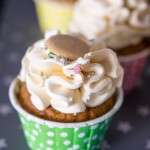 Butterbeer cupcake topped with Butterbeer Italian Meringue Buttercream, sprinkles and a Caramac button