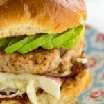 Mince some chicken thighs with smoked bacon to make these insanely tasty burgers! Then pile them high with Ranch Slaw and avocdo. a