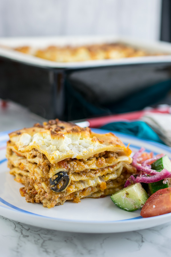 Greek lamb lasagne is a new take on a traditional Italian, beef ragu lasagne. With olives, feta and lamb this is one satisfying lasagne.