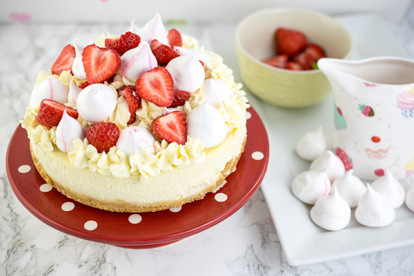 Instant Pot Eton Mess Cheesecake - a rich and delicious vanilla cheesecake cooked in the pressure cooker and topped with whipped vanilla cream, meringue kisses and fresh strawberries and sauce.